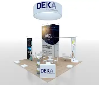 Spacious trade show booth with seating and signage